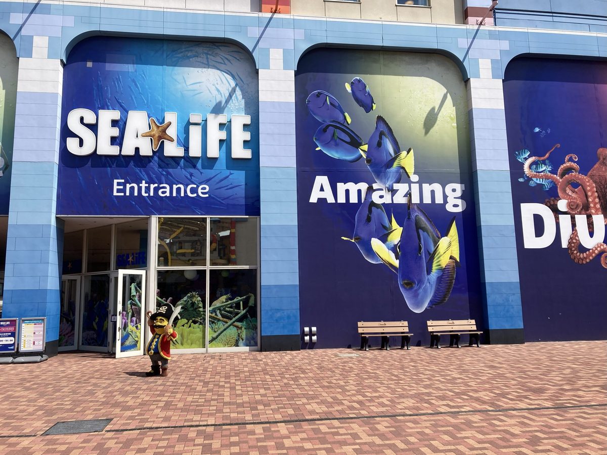 The SEA LIFE aquarium entrance, with its blue fish murals and a LEGO pirate