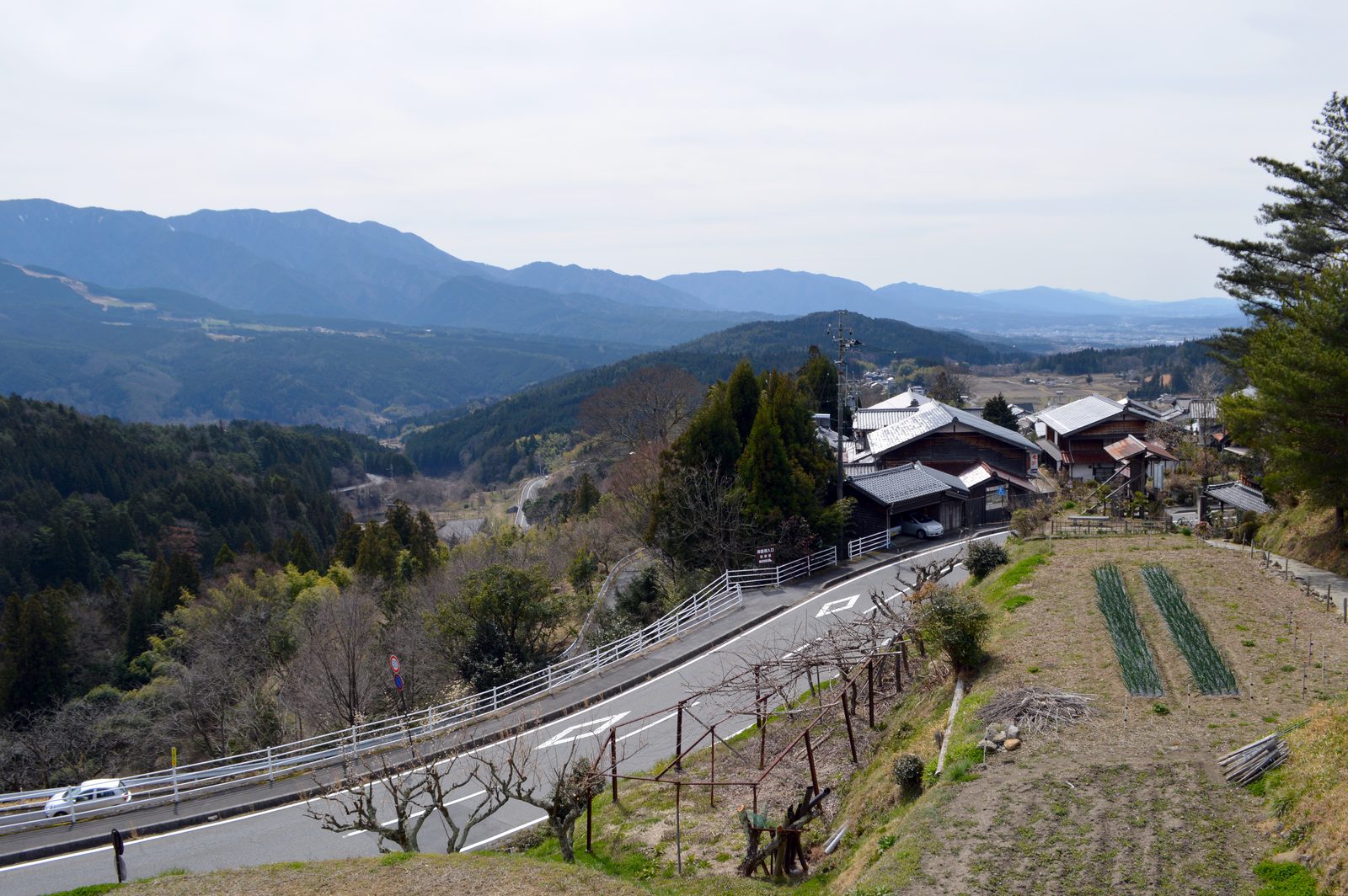 Looking out over the green hills of the Kiso valley from a viewpoint on the trail