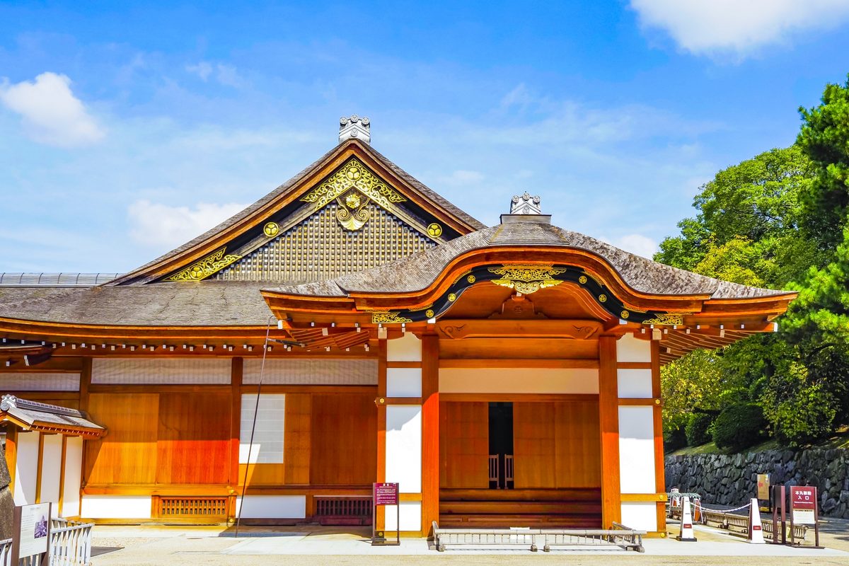 Hommaru Palace exterior in Japanese cypress, its gables crowned with gilded carvings.