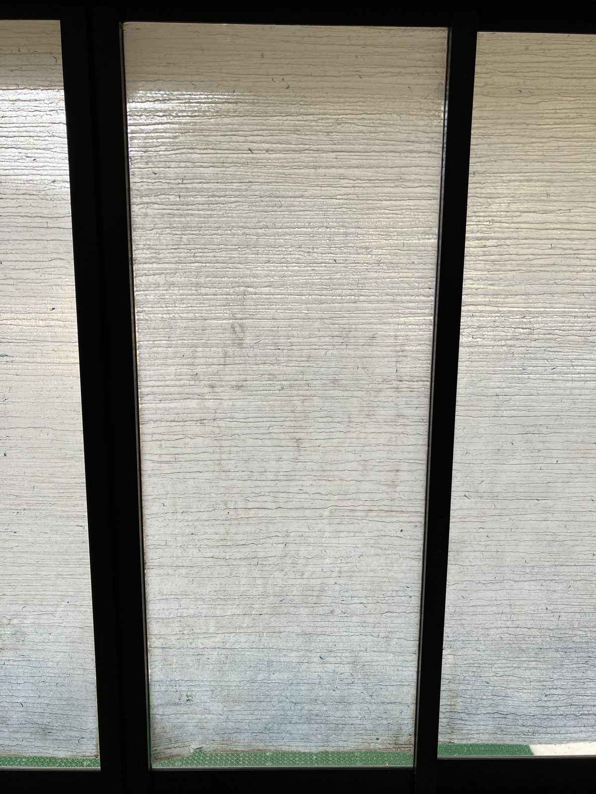 Close-up of translucent, textured handmade washi set into sliding panels.