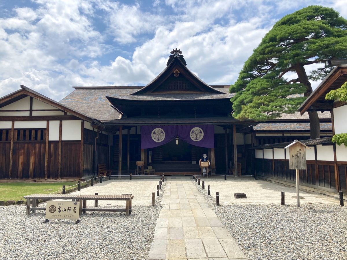 The Jinya's main hall with its purple curtain and grand old pine