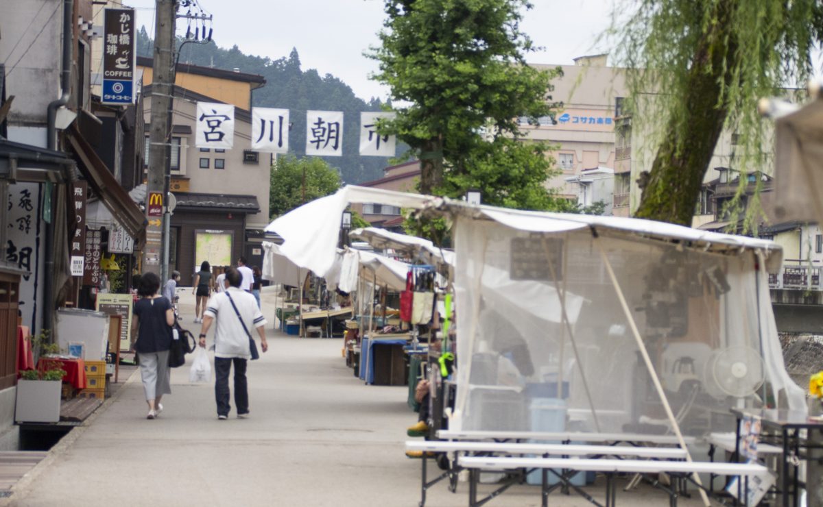 White-tented stalls of the Miyagawa morning market along the street
