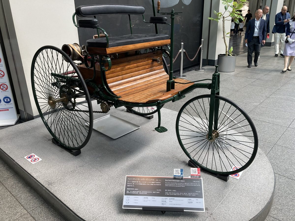 A replica of the 1886 Benz Patent-Motorwagen — widely called the world's first automobile — on three slender wheels.